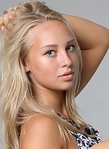 Gorgeous blonde teen posing topless
