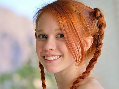 Redhead teen with pigtails shoves veggies up her bald pussy