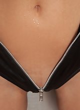 Flat-chested blonde in leather lingerie masturbating
