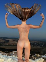 Shaved teen with firm tits nude on a mountain top