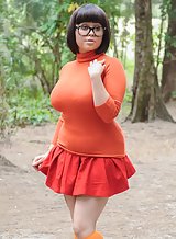 Busty brunette dressed as a Scooby-Doo's Velma Dinkley