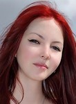 Hairy teen with red hair posing outdoors