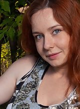 Freckled redhead with big tits spreads her hairy holes outdoors
