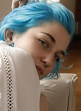Busty blue-haired girl flashing some skin