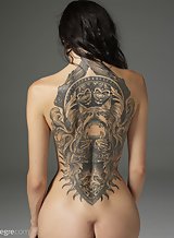 Ukranian beauty Oksi showing off her tattooed body