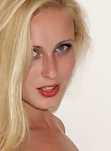 Shaved blonde with blue eyes toying