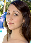 Gorgeous teen getting naked by the pool