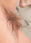 Hairy blonde with big areolas stripping