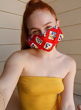Freckled redhead quarantined girl takes off her dress
