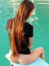 Skinny brunette teen with long hair nude by the pool