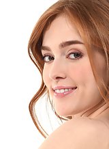 Sexy redhead Jia Lissa takes off her see-through top