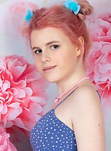 Cute pink-haired teen lifts up her dress