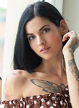 Stunning brunette babe Nesty stripping naked in set by Suicide Girls