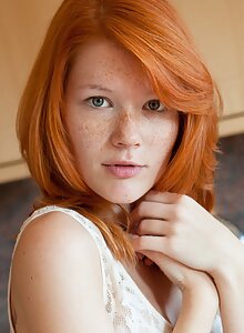 Stunning freckled redhead posing naked