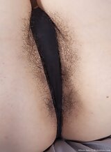 Black-haired amateur spreads her hairy holes