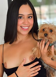 Sexy Latina lifts up her dress to fuck her pussy