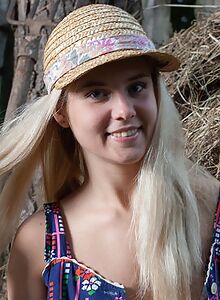 Cute blonde teen nude on a haystack