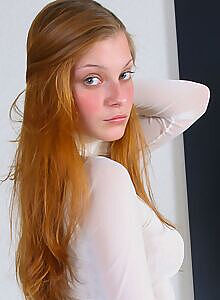 Cute redhead teen takes off her black thong
