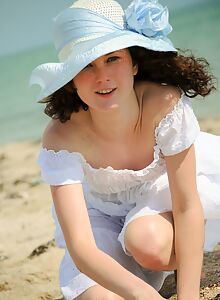 Pale brunette spreading at the beach