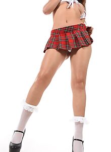 Brunette schoolgirl Camila Palmer lifts up her plaid skirt to fuck her pussy