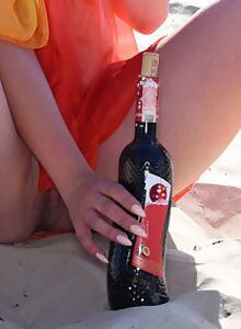 Flat-chested redhead shows off her big pussy lips at the beach