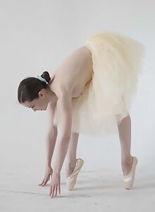 Busty brunette ballerina Emily Bloom practices her moves with exposed tits