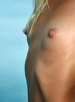 Flat-chested blonde with puffy nipples