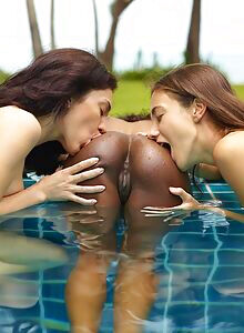 The teasing trio spreading shaved pussy together in the pool for Hegre