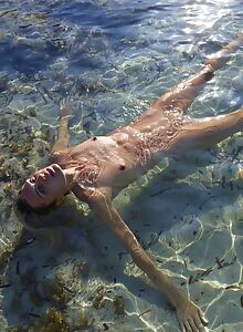 Nude model Francy posing on beach in Ibiza