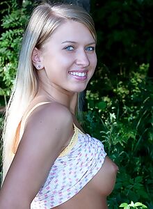Blue-eyed blonde with firm tits lifts up her skirt