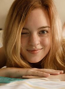 Freckled redhead teen cutie stripping in bed