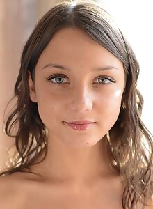 Freckled brunette teen posing nude
