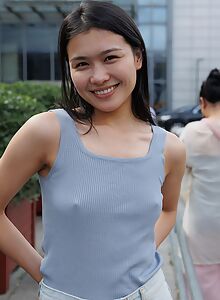 Cute Asian girl with hard nipples in public