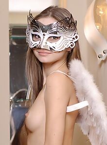Masked brunette girl nude with angel wings