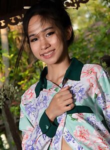 Cute Asian girl in lingerie on the terrace