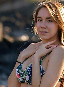 Gorgeous busty babe Ryana teasing near the beach in her bikini