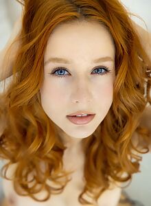 Stunning redhead teen Lila Rouge looks better than ever in black stockings and lingerie