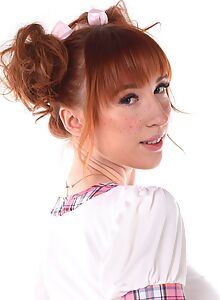Cute redhead with big tits toying in a schoolgirl uniform