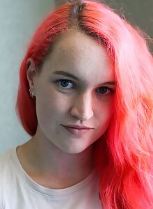 Freckled amateur with pink hair stripping on the balcony