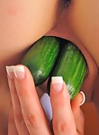 Brunette shoves veggies in her pussy