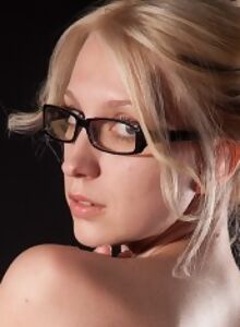 Nerdy blonde shows off her huge natural boobs