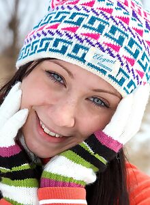 Blue-eyed teen stripping in the snow