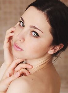 Green-eyed brunette bathing