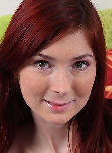 Freckled redhead toying both her holes