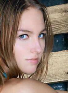 Blue-eyed teen posing nude