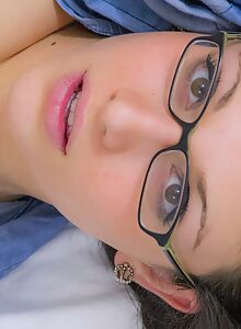 Nerdy brunette amateur stripping in bed