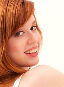 Sexy redhead teen pulls off her panties