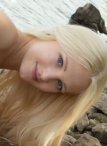 Blonde teen with big pussy lips nude by a lake