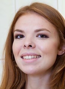 Cute redhead teen showering