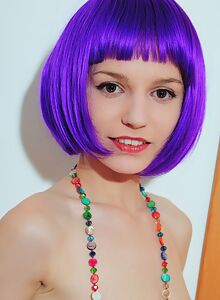 Skinny purple-haired girl spreads her shaved pussy